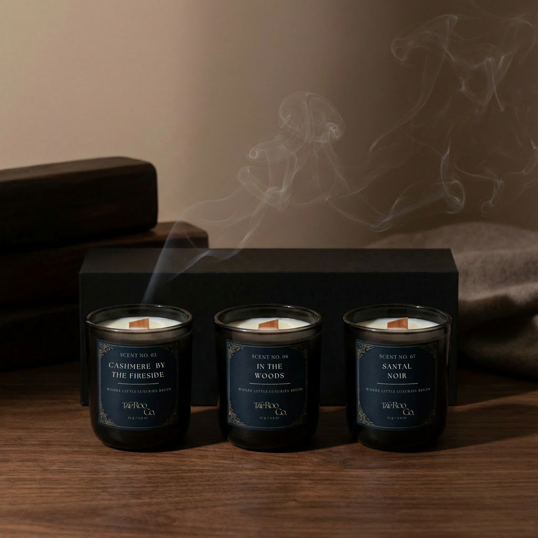 Three 2.5 oz mini woody candles featuring In the Woods, Santal Noir, and Cashmere by the Fireside