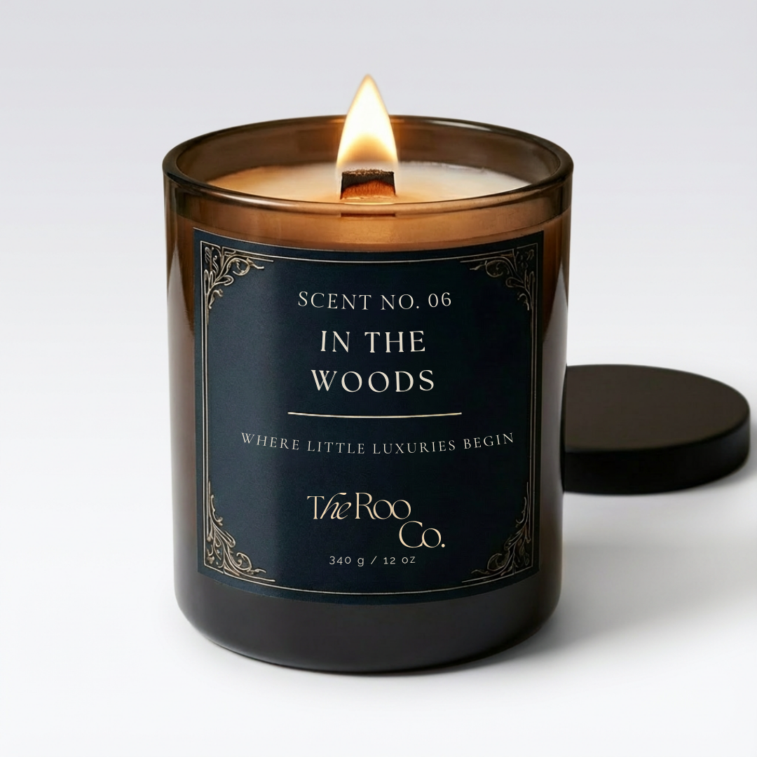 Luxury scented candle in dark glass jar with wooden wick – In the Woods by The Roo Co