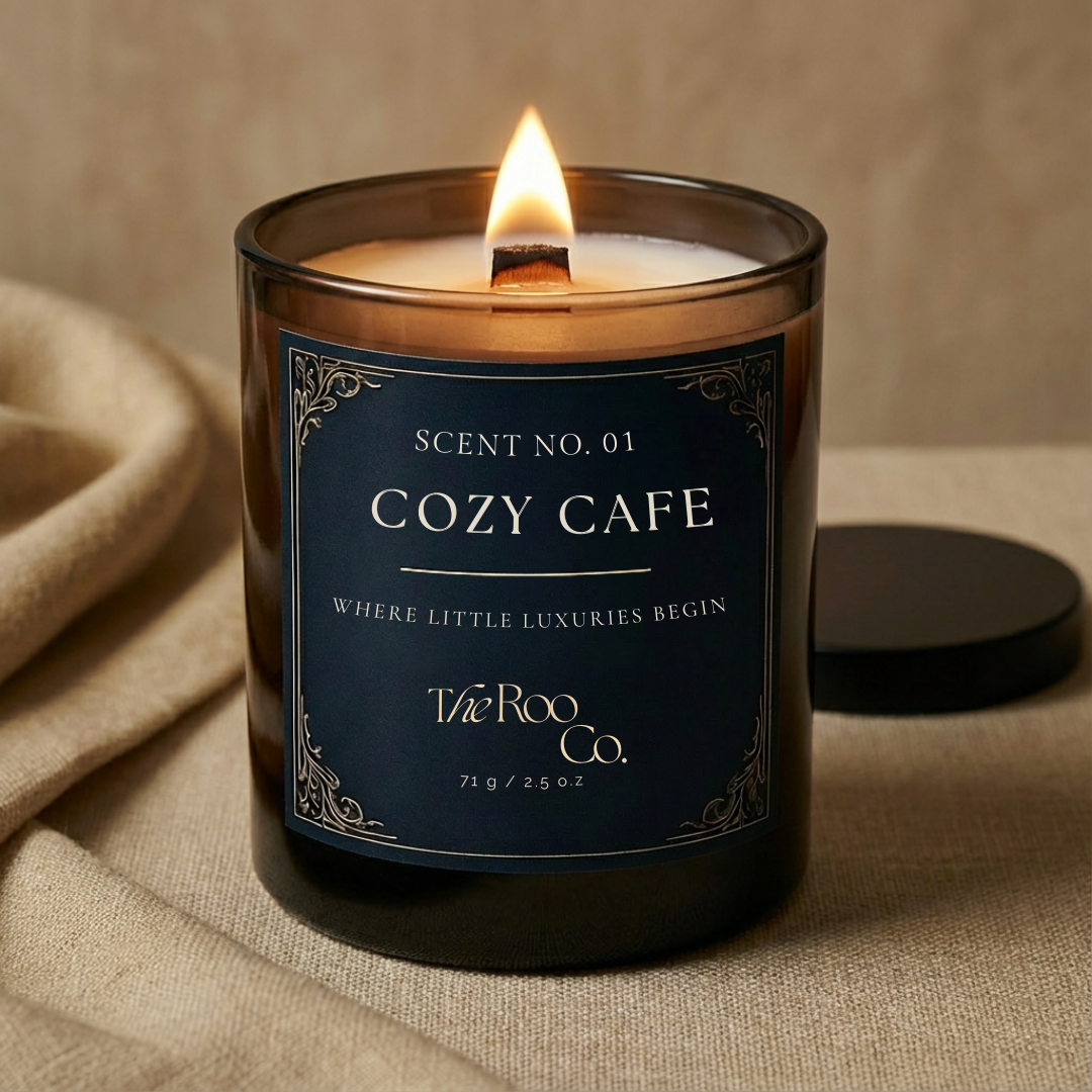 Luxury scented candle styled on neutral linen fabric – Cozy cafe warm home decor candle by The Roo Co