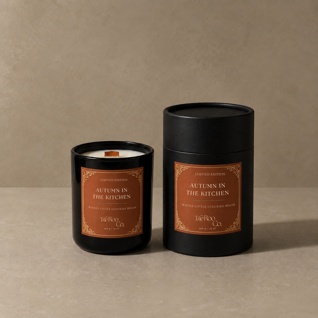 Autumn in the Kitchen candle and coordinating black gift packaging by The Roo Co, styled against a warm neutral background.