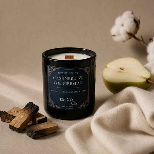 Luxury Cozy Café coconut soy candle with a wooden wick beside a latte, pears, palo santo, cashmere blankets and musk, with cotton, cashmere by the firesided candle 